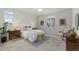 Serene bedroom featuring a queen-sized bed, carpet, and a ceiling fan at 113 Marlowe Dr, Erie, CO 80516