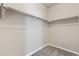 Walk-in closet with wrap around shelving and carpeted floor at 113 Marlowe Dr, Erie, CO 80516