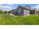 Exterior of a home with an outdoor area and lawn at 113 Marlowe Dr, Erie, CO 80516