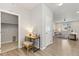 Hallway with office space, access to laundry room, open to living space with natural light at 113 Marlowe Dr, Erie, CO 80516