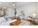 Cozy living room with modern furnishings, a ceiling fan, and plenty of natural light at 113 Marlowe Dr, Erie, CO 80516