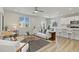 Bright and airy living room with modern decor, stylish furniture, and wood flooring at 113 Marlowe Dr, Erie, CO 80516