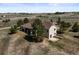 Aerial view of large property with home, trees, and white fencing at 43097 Taos Trl, Elizabeth, CO 80107