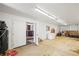 Barn interior with doors, compressor, freezer, and other equipment at 43097 Taos Trl, Elizabeth, CO 80107