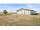 Large barn with sliding doors, perfect for storage or livestock, set on a spacious lot at 43097 Taos Trl, Elizabeth, CO 80107