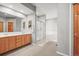 Bright bathroom features double vanity, shower, and separate tub at 43097 Taos Trl, Elizabeth, CO 80107