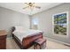 Bedroom featuring windows with natural light and a wooden bed frame at 43097 Taos Trl, Elizabeth, CO 80107