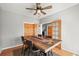 Elegant dining room boasts hardwood floors, decorative table setting, and stylish double doors at 43097 Taos Trl, Elizabeth, CO 80107