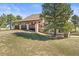 Spacious home features a covered deck, mature tree, and a well-maintained lawn in a serene setting at 43097 Taos Trl, Elizabeth, CO 80107