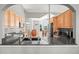 Modern kitchen with granite countertops, stainless steel appliances, and open view to the dining area at 43097 Taos Trl, Elizabeth, CO 80107