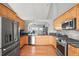 Updated kitchen with stainless steel appliances, granite countertops, and hardwood floors at 43097 Taos Trl, Elizabeth, CO 80107
