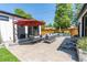 Well-maintained backyard featuring an outdoor seating area, dining area and a modern shed with a glass garage door at 4467 King St, Denver, CO 80211