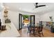 Bright dining room with shiplap walls and outdoor access to patio with black framed glass double doors at 4467 King St, Denver, CO 80211