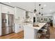 Beautiful kitchen with stainless steel appliances, quartz counters and breakfast bar at 4467 King St, Denver, CO 80211