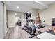 Finished basement with an elliptical, bicycle, and storage at 1818 S Quebec Way # 11-8, Denver, CO 80231