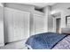 Bedroom with double closets and grey carpeting at 1818 S Quebec Way # 11-8, Denver, CO 80231