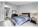 Spacious bedroom with a queen bed, nightstand, and built-in closet at 1818 S Quebec Way # 11-8, Denver, CO 80231