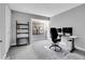 Home office with a desk, chair, and built in shelving at 1818 S Quebec Way # 11-8, Denver, CO 80231