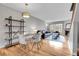 Bright dining area with a table and chairs, hardwood floors, and built-in shelving at 1818 S Quebec Way # 11-8, Denver, CO 80231