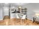 Bright dining area with hardwood floors and modern table set at 1818 S Quebec Way # 11-8, Denver, CO 80231