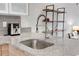 Modern kitchen sink and faucet with granite countertop at 1818 S Quebec Way # 11-8, Denver, CO 80231