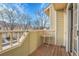 Private patio with table and surrounding trees at 1818 S Quebec Way # 11-8, Denver, CO 80231