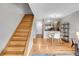 View of a light wood staircase leading to the upper level at 1818 S Quebec Way # 11-8, Denver, CO 80231