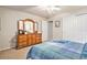 Bright bedroom with double bed, dresser, and ceiling fan at 3275 S Indiana St, Lakewood, CO 80228