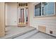 Home's entryway with door and steps at 3275 S Indiana St, Lakewood, CO 80228