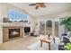 Living room with fireplace, sliding glass doors, and a view at 3275 S Indiana St, Lakewood, CO 80228