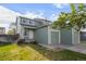 A charming two-story home with a well-maintained lawn, white door, and attached two-car garage at 747 Mockingbird St, Brighton, CO 80601