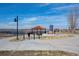 Scenic park view featuring well-maintained landscaping, covered picnic spots, and walking paths at 747 Mockingbird St, Brighton, CO 80601