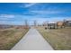 Scenic walking path with a gazebo, offering a peaceful outdoor experience with views of the surrounding park at 747 Mockingbird St, Brighton, CO 80601