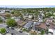 Neighborhood aerial view showcasing well-kept homes, mature trees, and neighborhood streets at 1414 W Nevada Pl, Denver, CO 80223