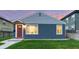 Charming single-story home with a well-maintained lawn and inviting red front door at 1414 W Nevada Pl, Denver, CO 80223