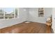 Inviting living room with hardwood floors, large windows, and neutral decor creating a bright and open atmosphere at 1414 W Nevada Pl, Denver, CO 80223