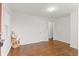 Spacious living room with hardwood floors, ample natural light, and a minimalist design providing a clean and airy feel at 1414 W Nevada Pl, Denver, CO 80223