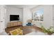 Bright and airy living room with hardwood floors, modern furnishings, and neutral tones at 1414 W Nevada Pl, Denver, CO 80223