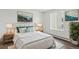 Serene bedroom with white bedding, soft pillows, and a large window for natural light at 14700 E Kentucky Dr # 524, Aurora, CO 80012
