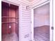 Hallway connecting to an exterior storage unit and a bedroom, features laminate flooring at 14700 E Kentucky Dr # 524, Aurora, CO 80012