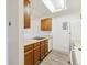 Kitchen with wood cabinets and white appliances at 14700 E Kentucky Dr # 524, Aurora, CO 80012