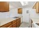 Kitchen featuring wood cabinets and white appliances at 14700 E Kentucky Dr # 524, Aurora, CO 80012