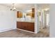 Cozy kitchen with wood cabinets and white appliances at 14700 E Kentucky Dr # 524, Aurora, CO 80012
