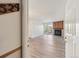 View of the living room with a fireplace and sliding glass doors to a balcony at 14700 E Kentucky Dr # 524, Aurora, CO 80012