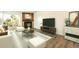 Bright living room with stylish decor, fireplace, and balcony access at 14700 E Kentucky Dr # 524, Aurora, CO 80012
