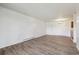 Open living room with hardwood flooring and overhead lighting at 14700 E Kentucky Dr # 524, Aurora, CO 80012
