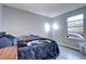 Bright bedroom featuring wood-look floors and a window at 1370 S Idalia St # C, Aurora, CO 80017