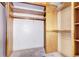 Shelved closet with hanging rods and wooden interior at 1370 S Idalia St # C, Aurora, CO 80017