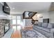 Living room with hardwood floors, fireplace and stairs at 1370 S Idalia St # C, Aurora, CO 80017