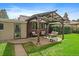 Backyard patio with pergola, seating, and landscaping at 3131 S Leyden St, Denver, CO 80222